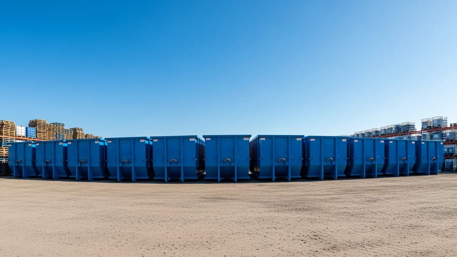Row of roll-off dumpsters at a staging yard